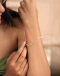 A timeless gold-plated tennis bracelet featuring elegant rose-pink stones that add a soft sparkle and luxurious charm to any look